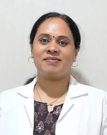 Dr Devi M